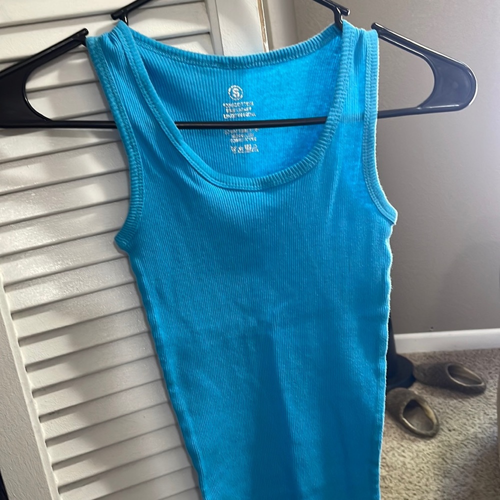 Light blue muscle tank. Super super stretchy. Size small with no brand name.
